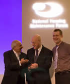 Ali Khan presenting the award to Bournville Village Trust